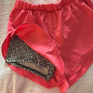 SHEIN pink workout shorts with cheetah lining